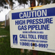 A warning sign for a gas pipeline is mounted near the Scattergood Generating Station on February 12, 2019 in El Segundo, California.